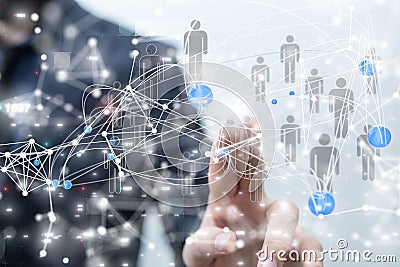 Businessman navigating a detailed hologram with gray people icons Stock Photo