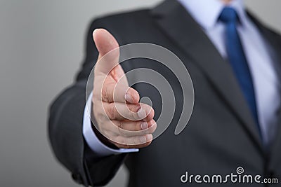 Businessman offering his hand for handshake Stock Photo