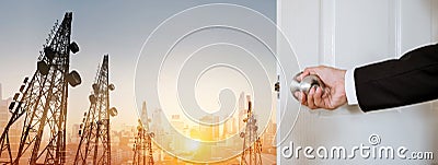 Businessman opening door, with panoramic double exposure panoramic cityscape and telecommunication towers in sunrise Stock Photo