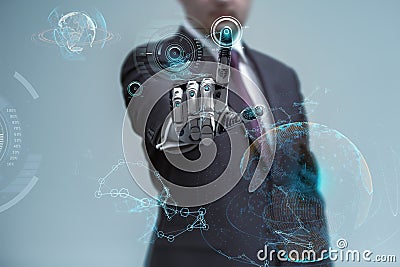 Businessman operating virtual hud interface and manipulating elements with robotic hand Stock Photo