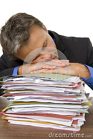 Businessman Overwhelmed By Paperwork Stock Photo