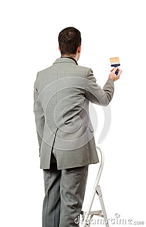 Businessman Painting A Sign Stock Photo