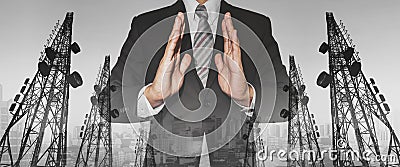 Businessman with panoramic double exposure telecommunication towers, and background Stock Photo
