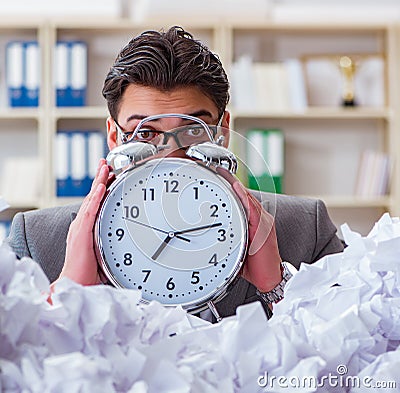 Businessman in paper recycling concept in office Stock Photo