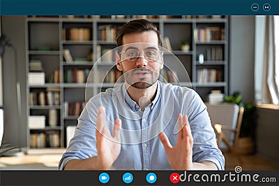 Businessman participates at negotiations by videocall via teleconference, screen view Stock Photo