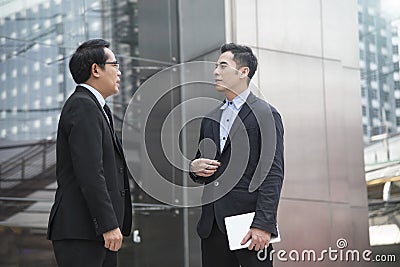 Businessman partner consulting and discussing at outdoor Stock Photo