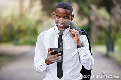 Businessman, phone and typing in city for news online, internet and text message. Male banker, mobile and communication Stock Photo