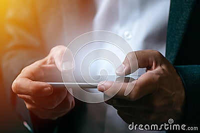 Businessman playing mobile app video game on smart phone Stock Photo