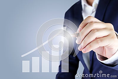 Businessman pointing a growth graph Stock Photo