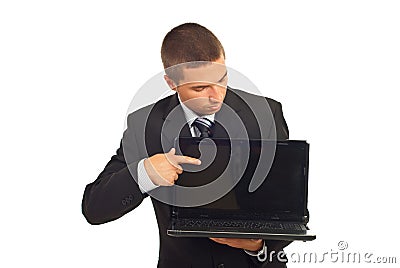 Businessman pointing and looking to laptop screen Stock Photo