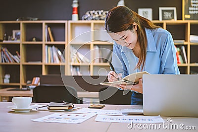 businessman pointing with pen on business report chart are working on accounts in business analysis with graphs and documentation Stock Photo