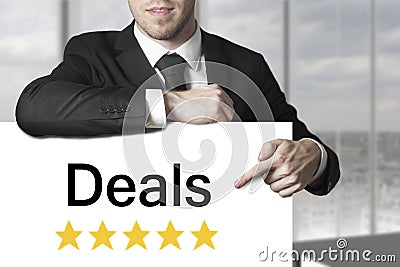 Businessman pointing on sign deals golden rating stars Stock Photo