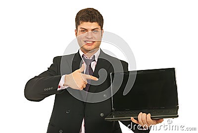 Businessman pointing to laptop screen Stock Photo