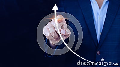 Businessman pointing touching growth on up arrow chart icon, hands touch the up arrow that represents profit rises, monetary Stock Photo