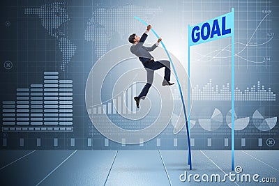 The businessman pole vaulting towards his goal in business concept Stock Photo