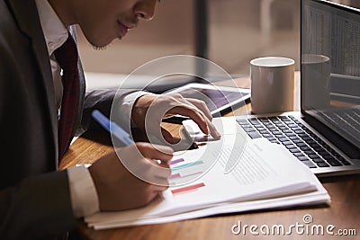 Businessman preparing a document, close up, side view Stock Photo