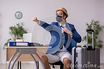 Businessman preparing for trip during pandemic Stock Photo