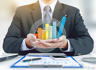 Businessman present rising graph,growth concept Stock Photo