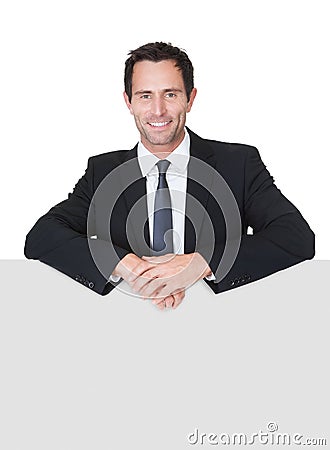 Businessman presenting empty banner Stock Photo