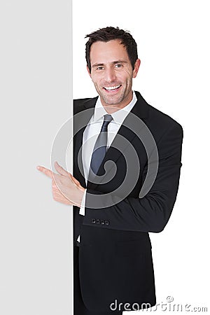 Businessman presenting empty banner Stock Photo