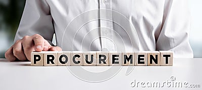 Businessman pressing his finger on the wooden cubes with the word procurement. Business logistics Stock Photo