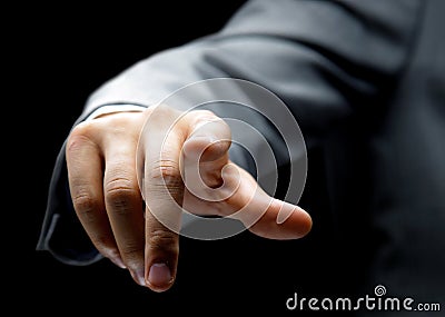 Businessman pressing an imaginary button Stock Photo