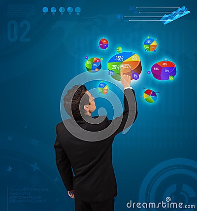 Businessman pressing pie chart button Stock Photo