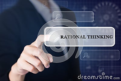 Businessman pressing a RATIONAL THINKING concept button. Stock Photo