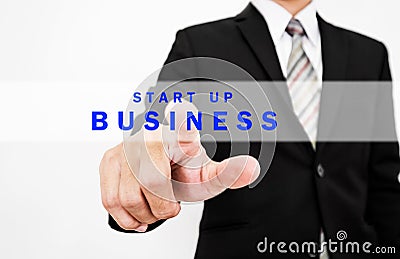 Businessman pressing start up BUSINESS button on screen display, concept of start new business or forward thinking Stock Photo