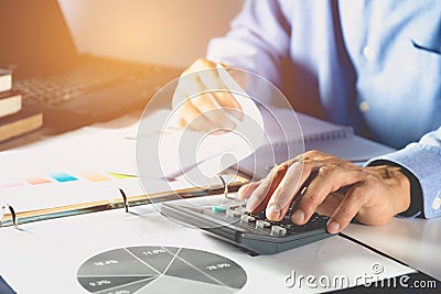 Businessman process and using calculator. Businessman working Stock Photo