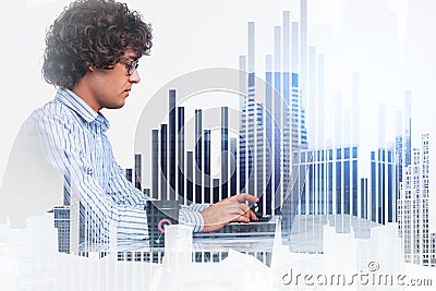 Businessman profile working with laptop, bar chart and skyscrape Stock Photo