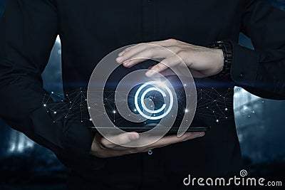 Businessman protect copyright icon on tablet online Stock Photo