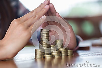 Businessman Protecting Coins. Financial safety Concept. Stock Photo