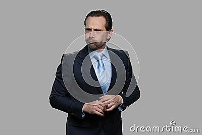 Businessman puffing out cheeks. Stock Photo