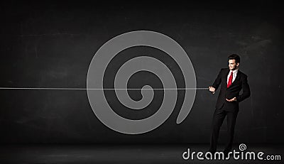 Businessman pulling rope on grey background Stock Photo