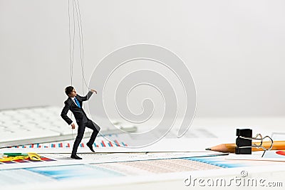Businessman puppet doll is on the desk Stock Photo