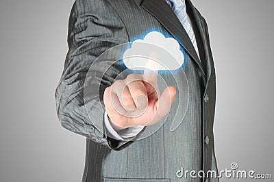 Businessman pushes virtual cloud button Stock Photo