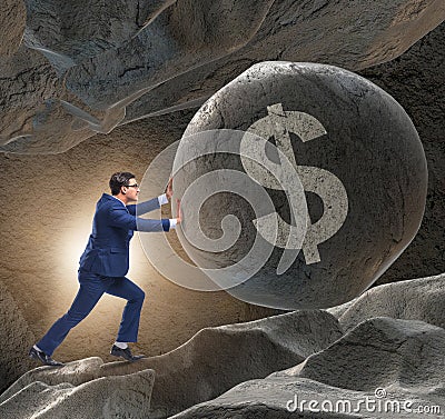 Businessman pushing dollar sign in business concept Stock Photo