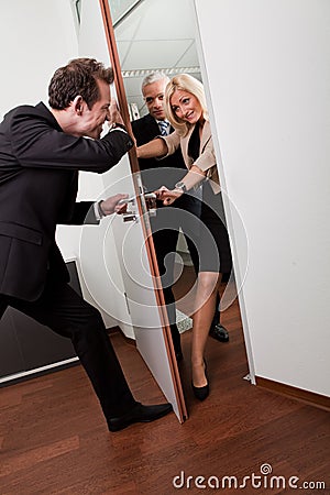 Businessman pushing the door Stock Photo