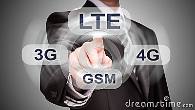Businessman pushing finger on lte button Stock Photo