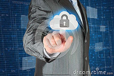 Businessman pushing virtual cloud security button Stock Photo