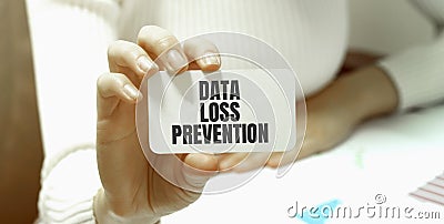 Businessman putting a card with text Data Loss Prevention Stock Photo