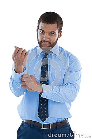 Businessman putting the cuff buttons Stock Photo