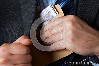 Businessman Putting Envelope Filled With Sterling In Jacket Pock Editorial Stock Photo