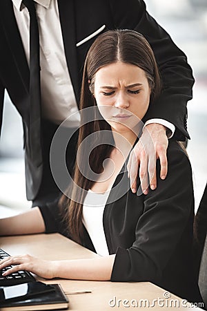 Sexual harrasment at work Stock Photo