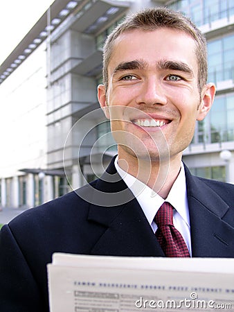 Businessman reading newspaper Stock Photo