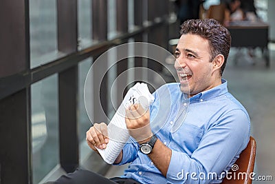 Businessman reading newspaper over office building. Businessman happy smiling after reading goods news. Man goot a new job Stock Photo