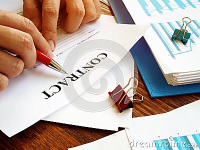 Businessman reads contract in the office for signing Stock Photo