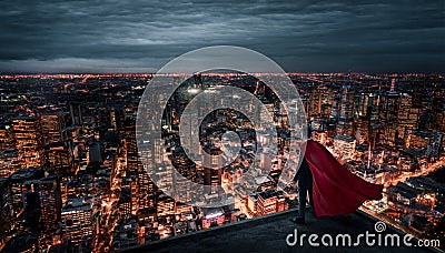 Businessman with red cape standing on the rooftop Stock Photo