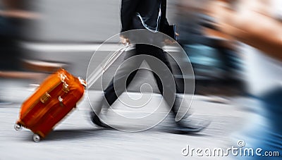 Businessman with a red suitcase in a hurry Stock Photo